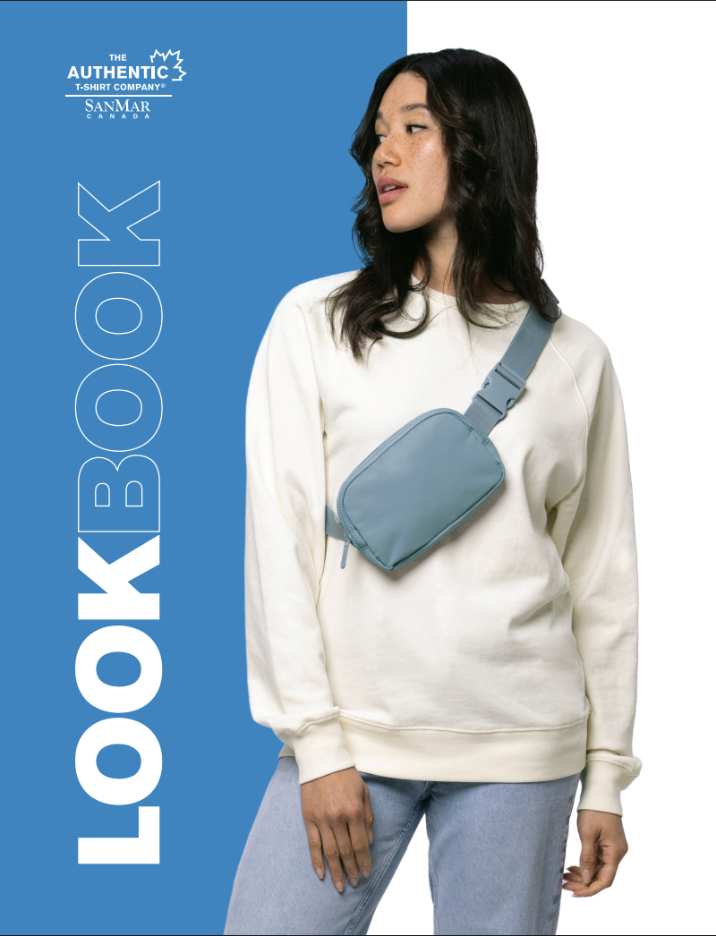 The Authentic T-Shirt Company SanMar Canada Lookbook cover — woman wearing a white crewneck sweatshirt with a crossbody bag