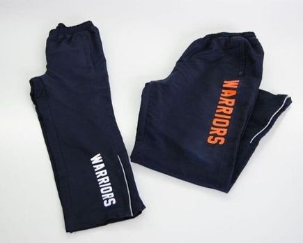 pants with warriors text printed on it
