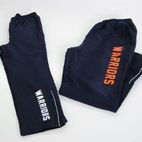 pants with warriors text printed on it