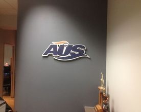 company logo installed on a wall 